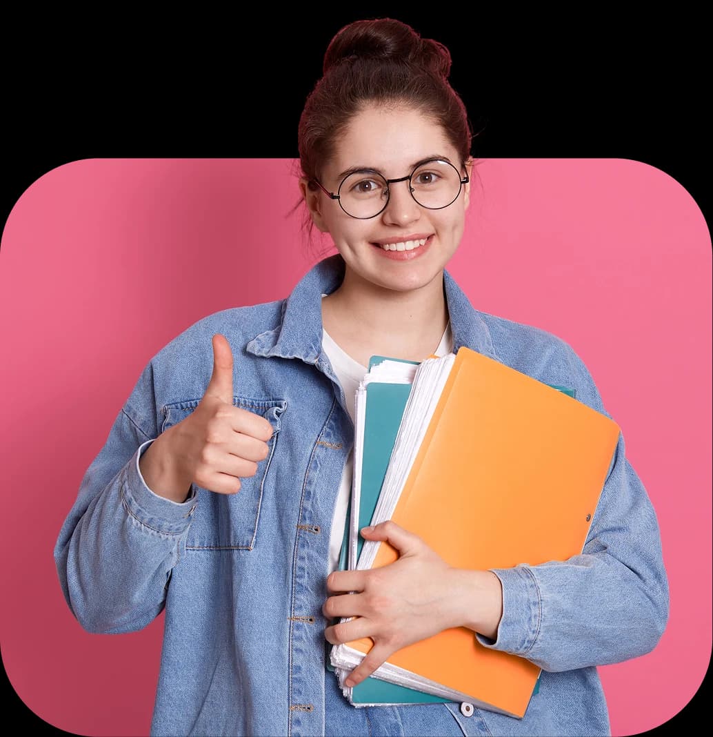 Smiling student holding books